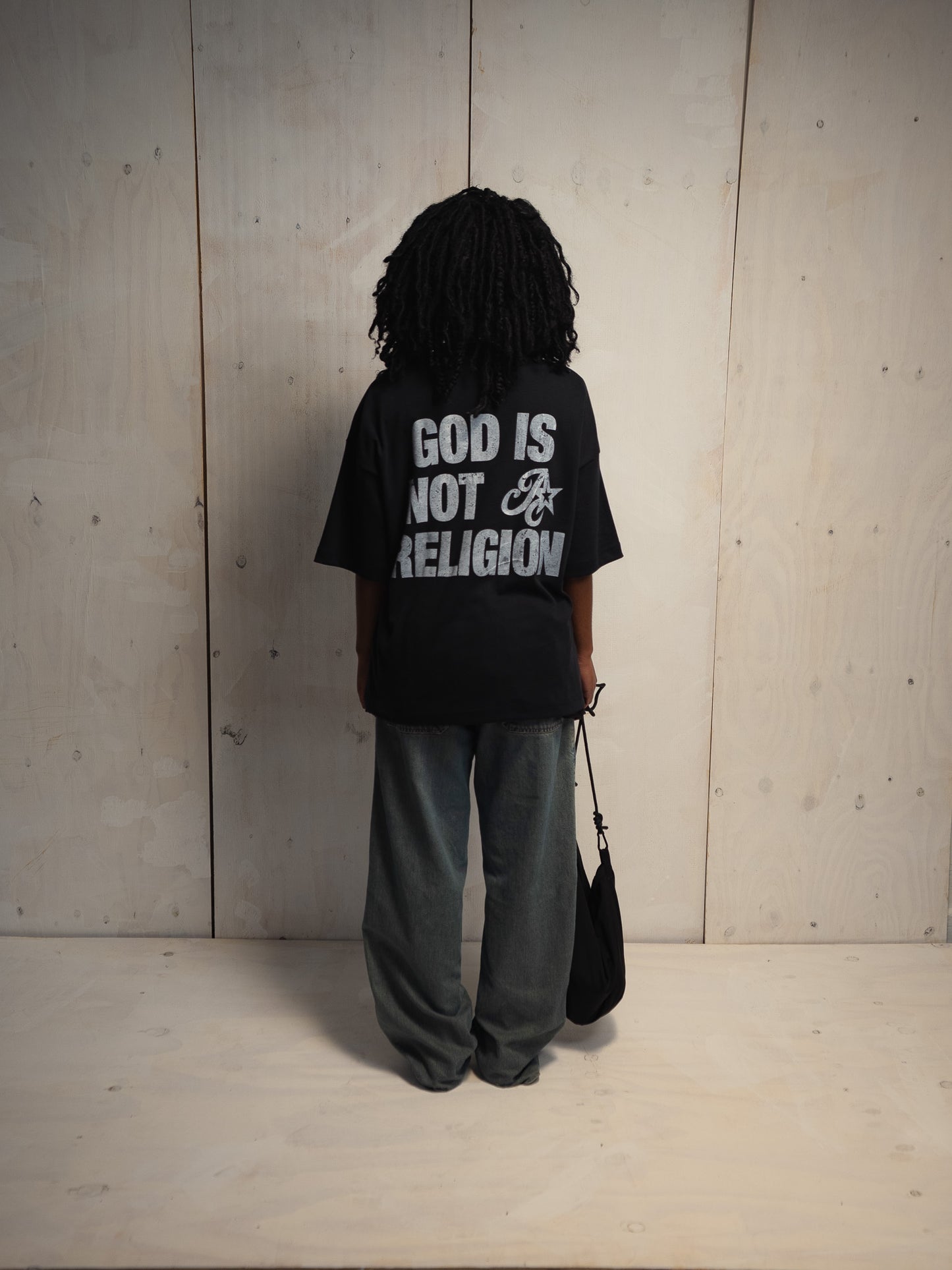 GOD IS NOT A RELIGION BLACK T-SHIRT
