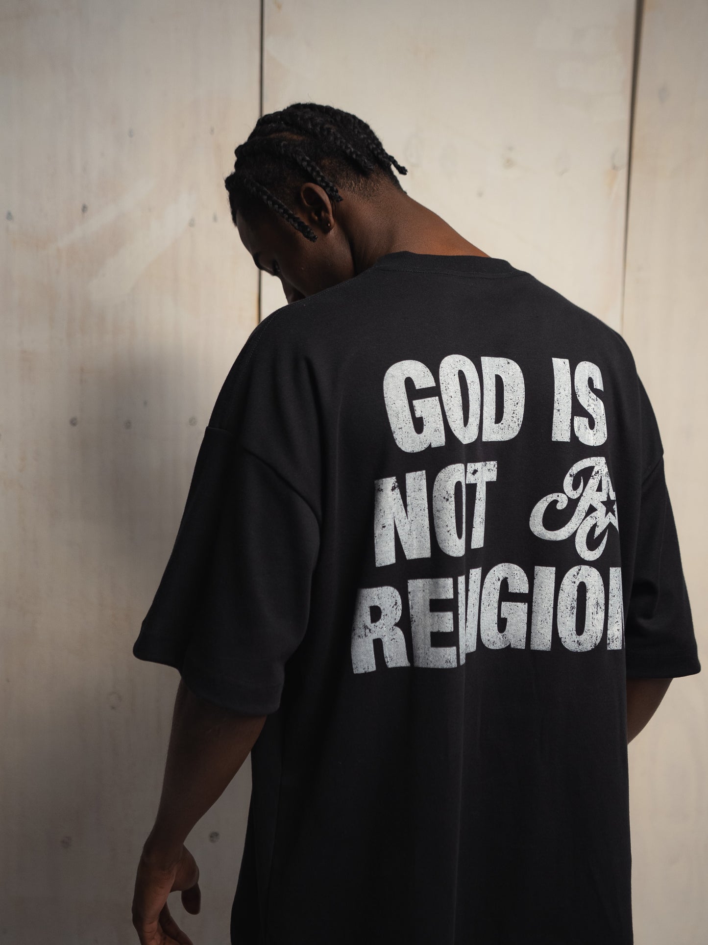 GOD IS NOT A RELIGION BLACK T-SHIRT