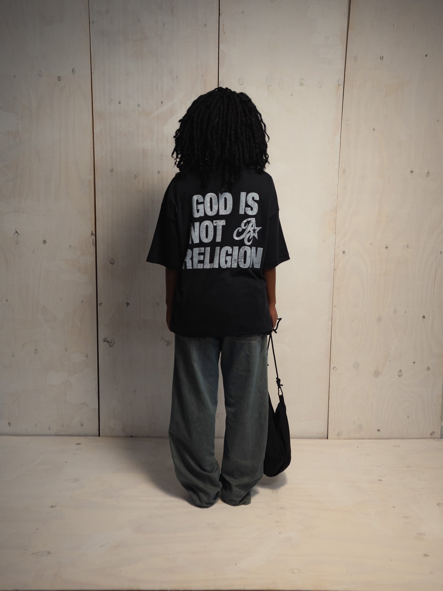 GOD IS NOT A RELIGION BLACK T-SHIRT