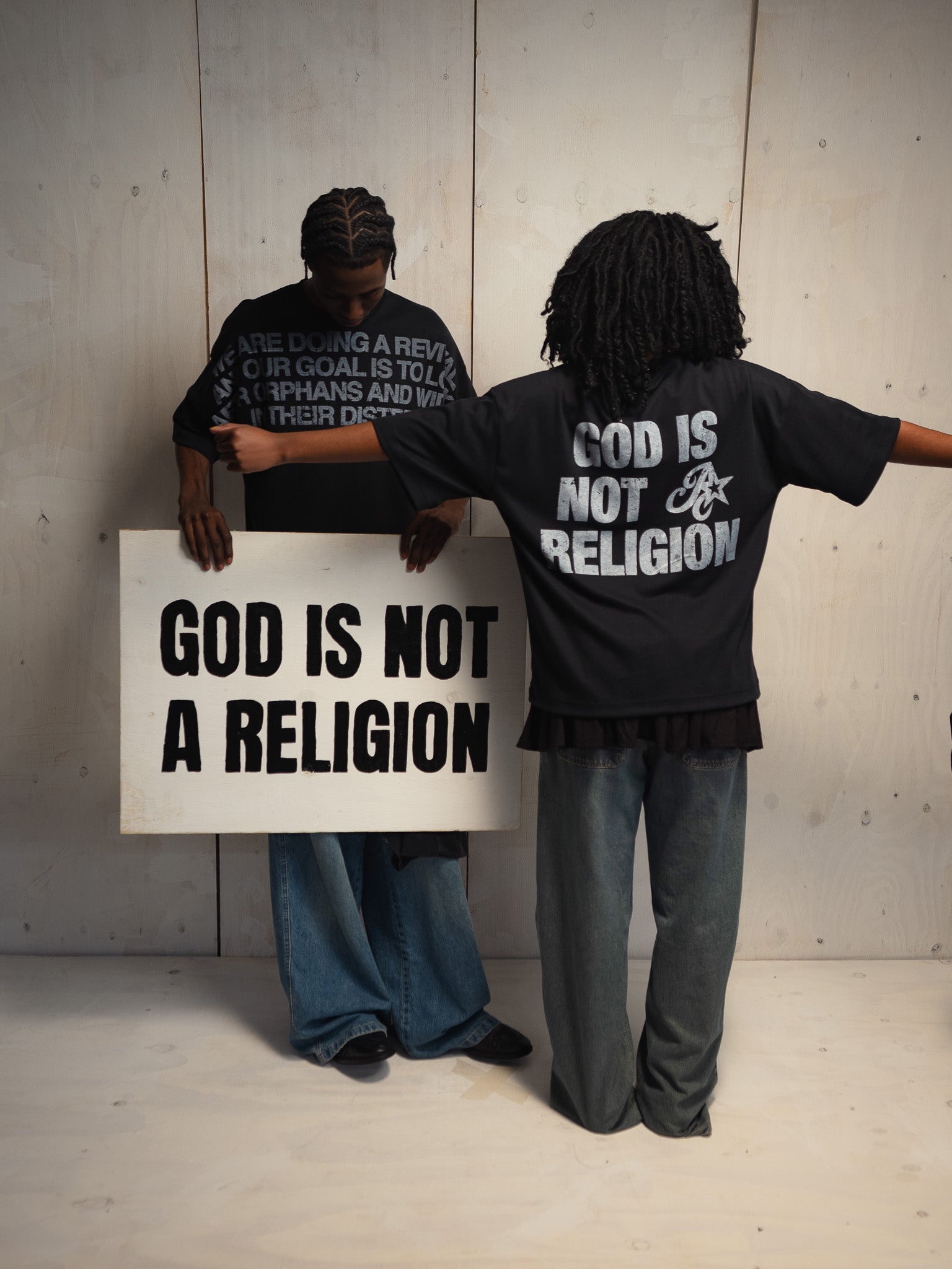 GOD IS NOT A RELIGION BLACK T-SHIRT