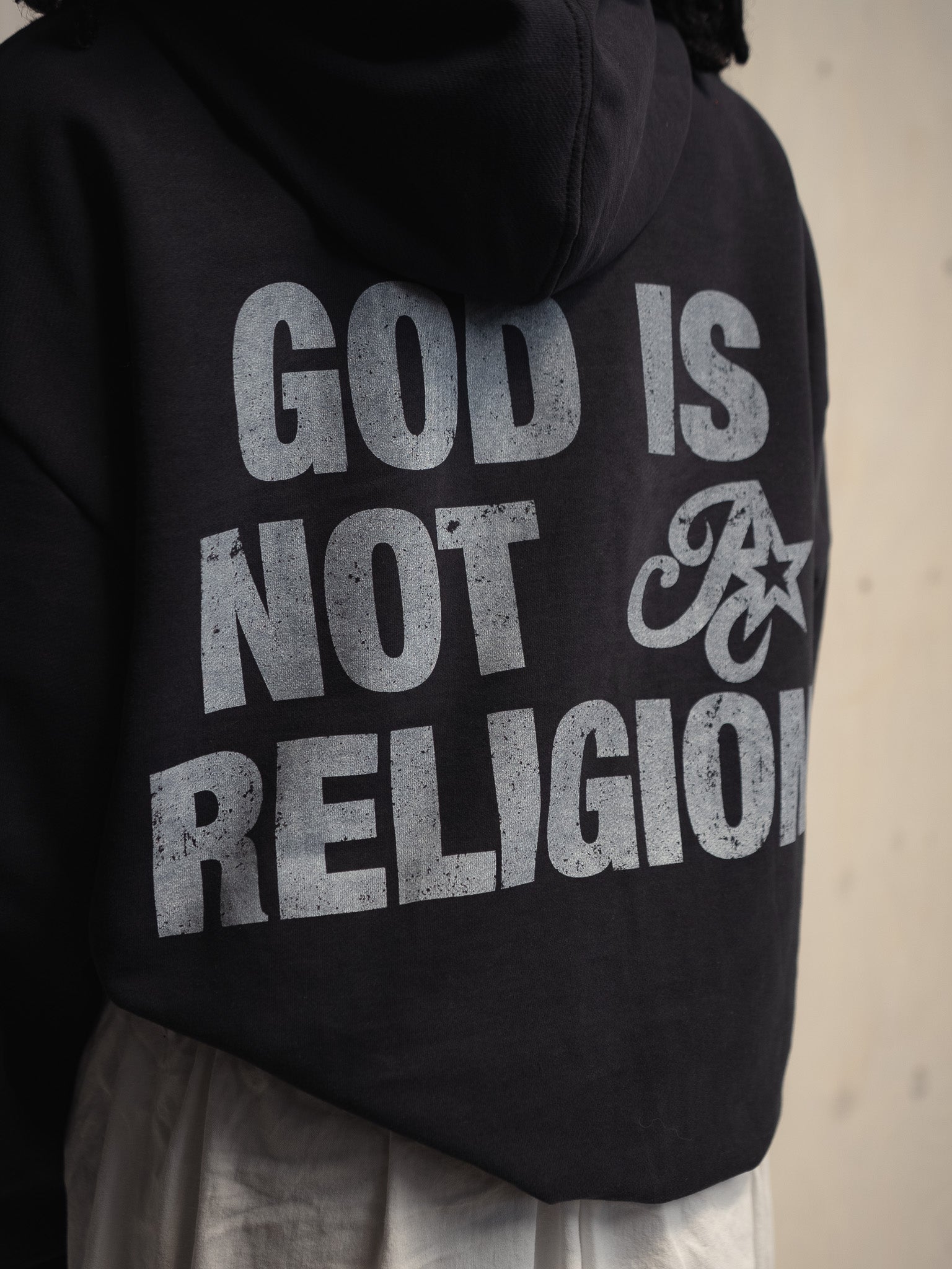 GOD IS NOT A RELIGION WASHED BLACK SWEATSHIRT